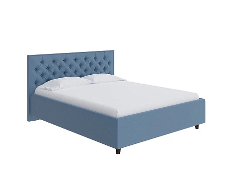 Кровать 140х190 Teona - Кровать с высоким изголовьем, украшенным благородной каретной пиковкой.