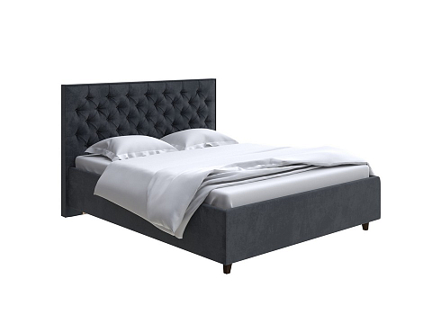 Кровать из экокожи Teona Grand - Кровать с увеличенным изголовьем, украшенным благородной каретной пиковкой.
